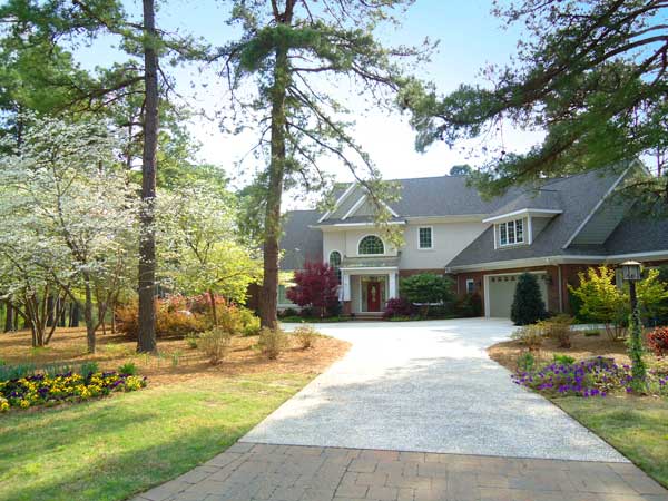 a creative and elegant driveway and entryway